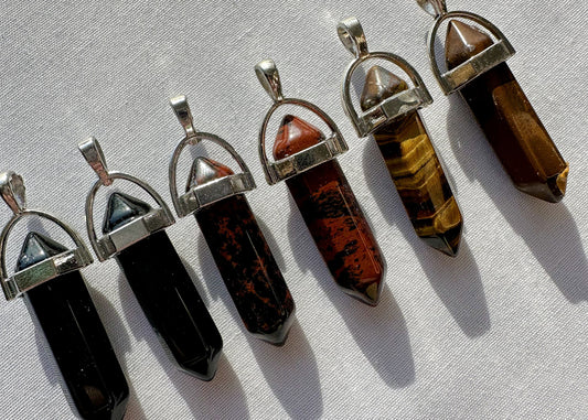 crystal pendants in tigers eye, obsidian and mahogany obsidian.